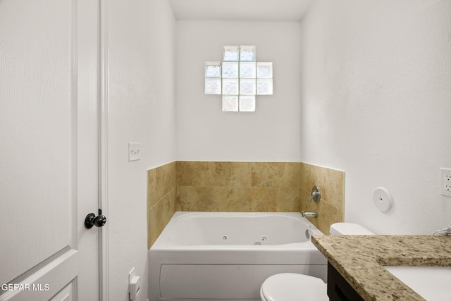 bathroom featuring a bath, toilet, and vanity