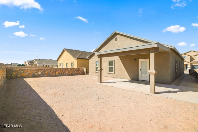 rear view of property with a patio area