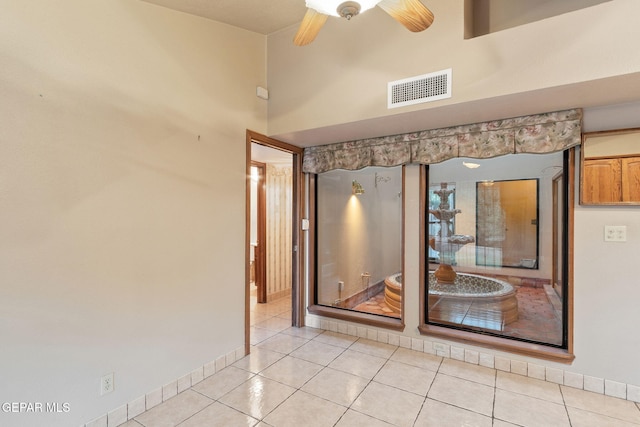 interior details with tile patterned flooring and ceiling fan