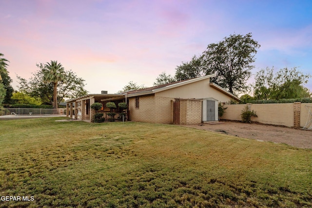 exterior space with a yard and a carport