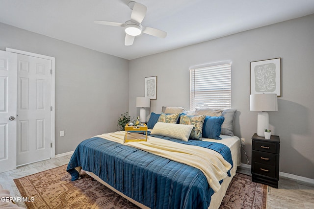 bedroom featuring light hardwood / wood-style flooring and ceiling fan