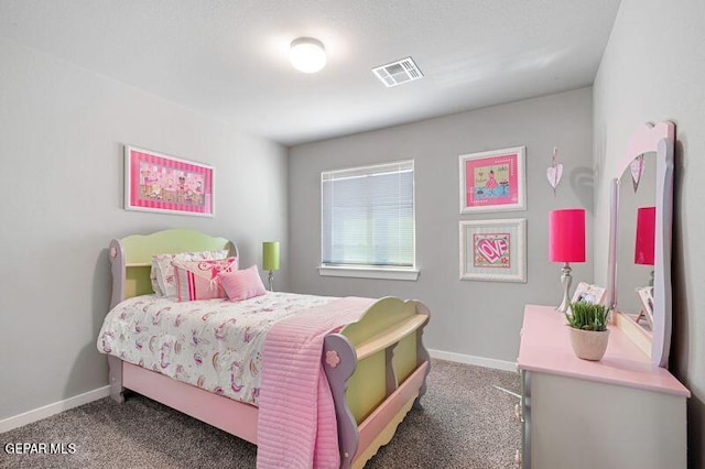 bedroom with dark colored carpet