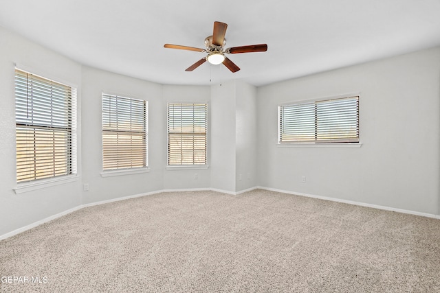 unfurnished room with carpet floors and ceiling fan