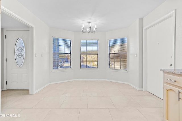 unfurnished dining area with light tile patterned flooring and an inviting chandelier