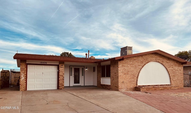 single story home featuring a garage