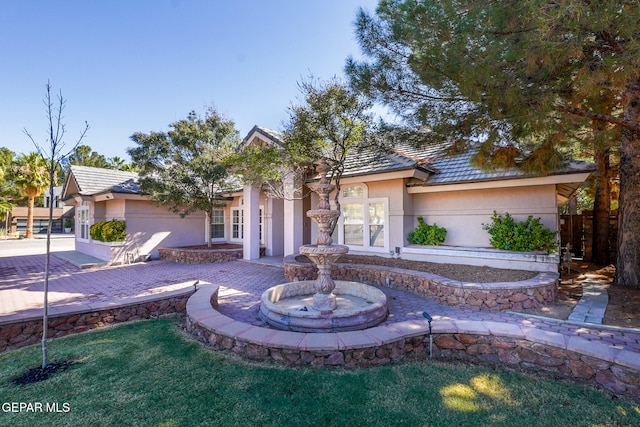 view of front of property with a patio