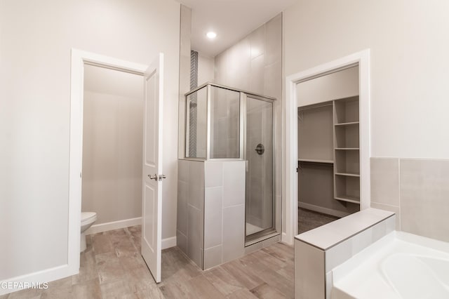 bathroom with separate shower and tub and toilet