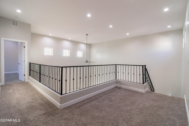 hallway featuring carpet flooring