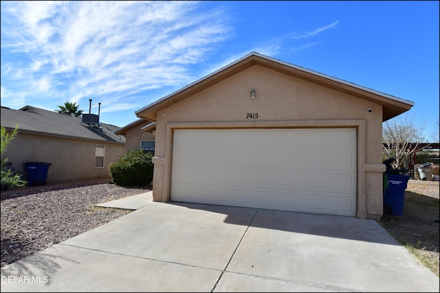 exterior space with a garage and an outdoor structure