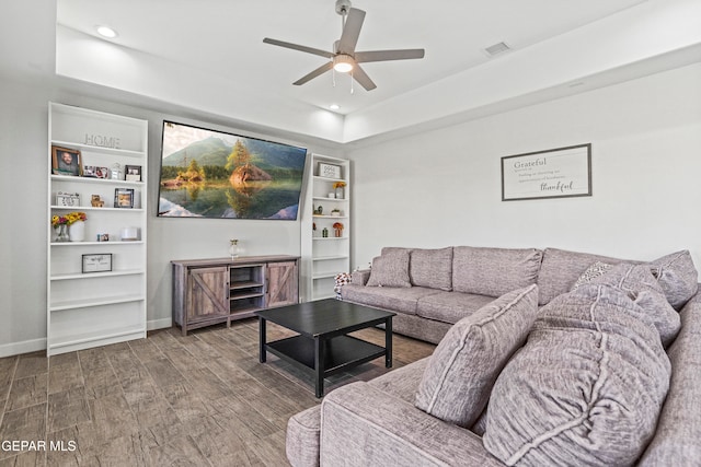 living room with hardwood / wood-style flooring and ceiling fan