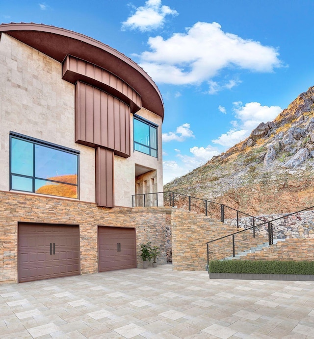 1609 Camino Alto Rd, El Paso, TX 79902 - view of patio with an attached garage, fence, and a mountain view