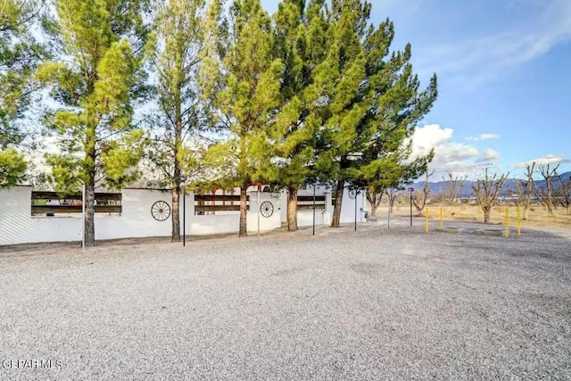 view of gate featuring a mountain view