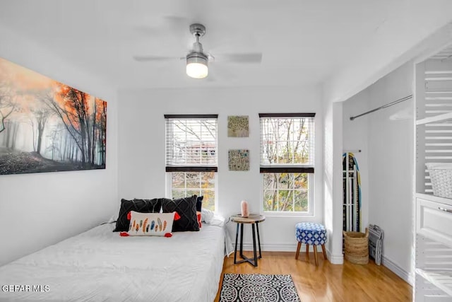 bedroom featuring ceiling fan and light hardwood / wood-style flooring