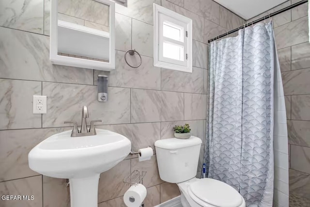 bathroom with toilet and walk in shower