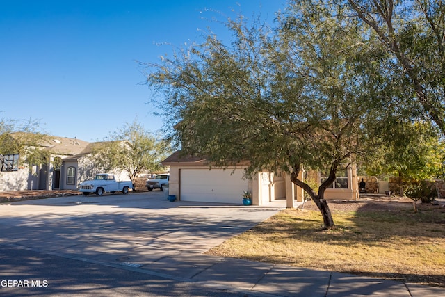 obstructed view of property featuring a garage