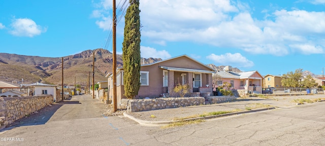 view of front of home featuring a mountain view