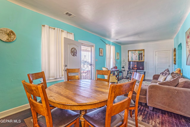 dining room with dark hardwood / wood-style floors