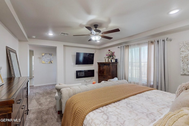 bedroom featuring ceiling fan and light carpet