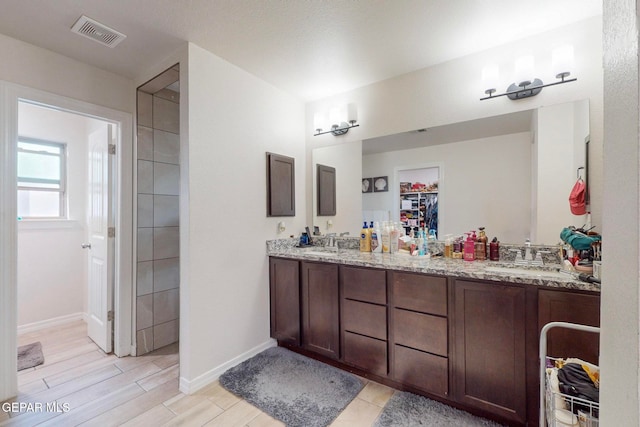 bathroom with hardwood / wood-style floors and vanity