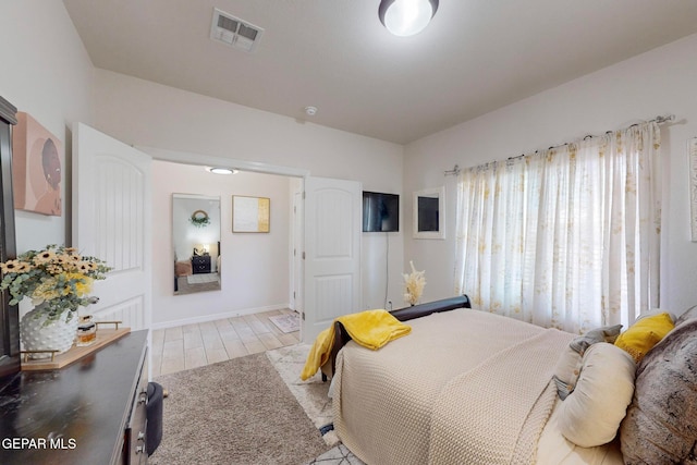 bedroom featuring light hardwood / wood-style floors