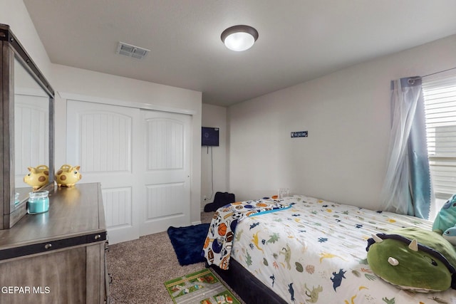 carpeted bedroom with a closet