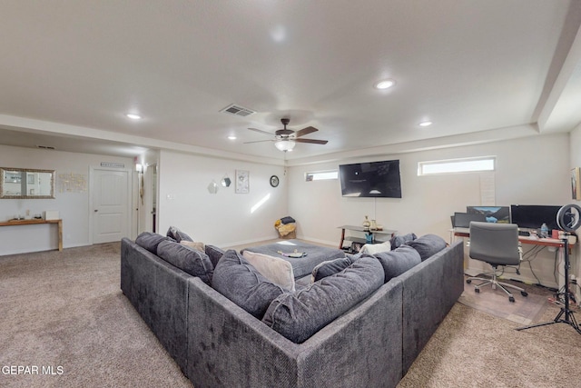 carpeted living room with ceiling fan