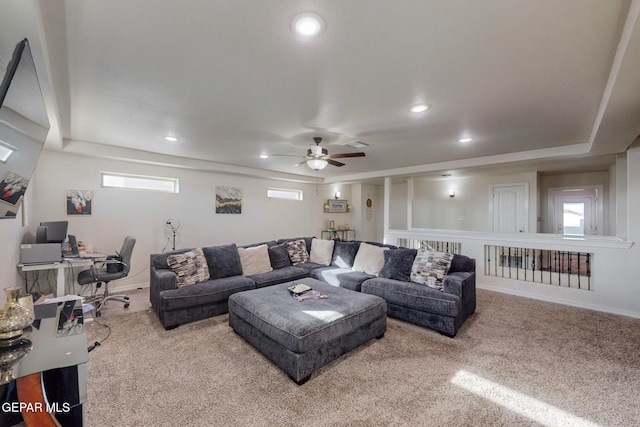 carpeted living room featuring ceiling fan