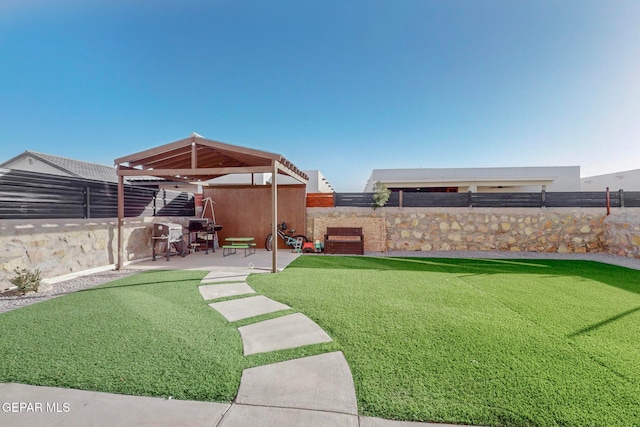 view of yard featuring a gazebo and a patio area