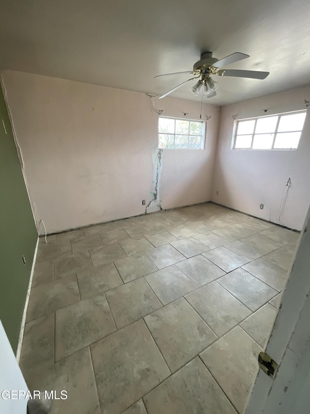 unfurnished room featuring ceiling fan