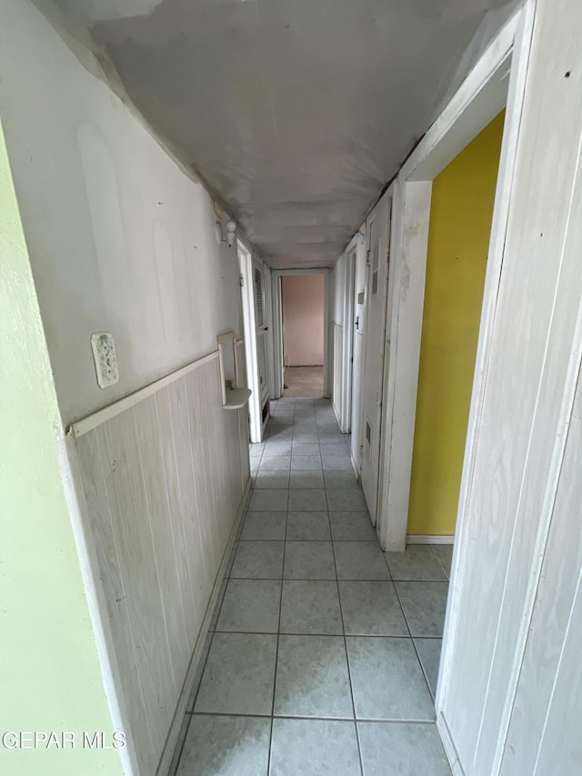 hallway with light tile patterned flooring