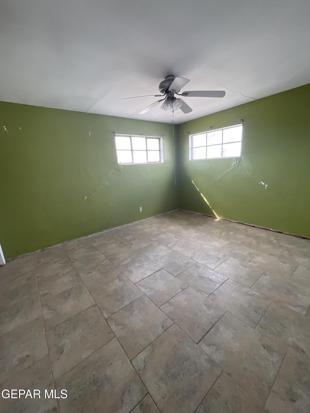 spare room featuring ceiling fan