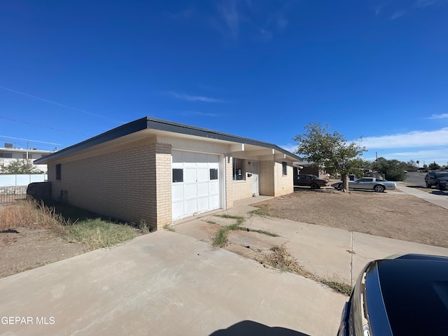 view of side of property featuring a garage