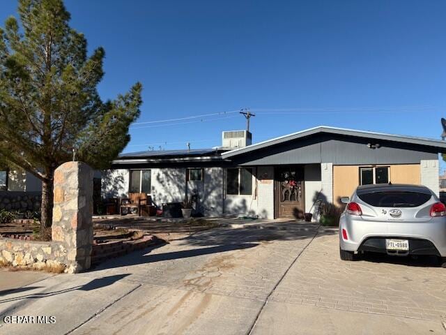 view of front of house with solar panels