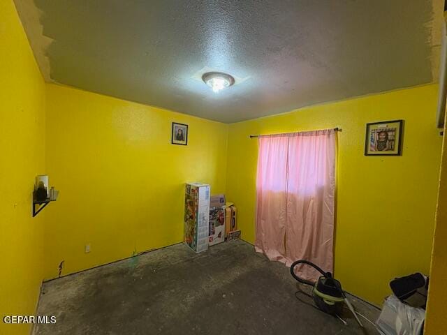 interior space featuring a textured ceiling