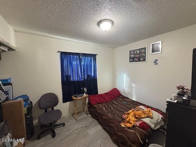 bedroom with a textured ceiling