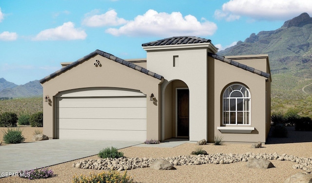 view of front of property with a mountain view and a garage