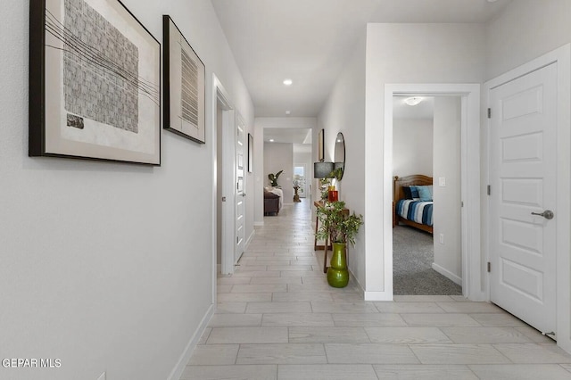 corridor with light colored carpet