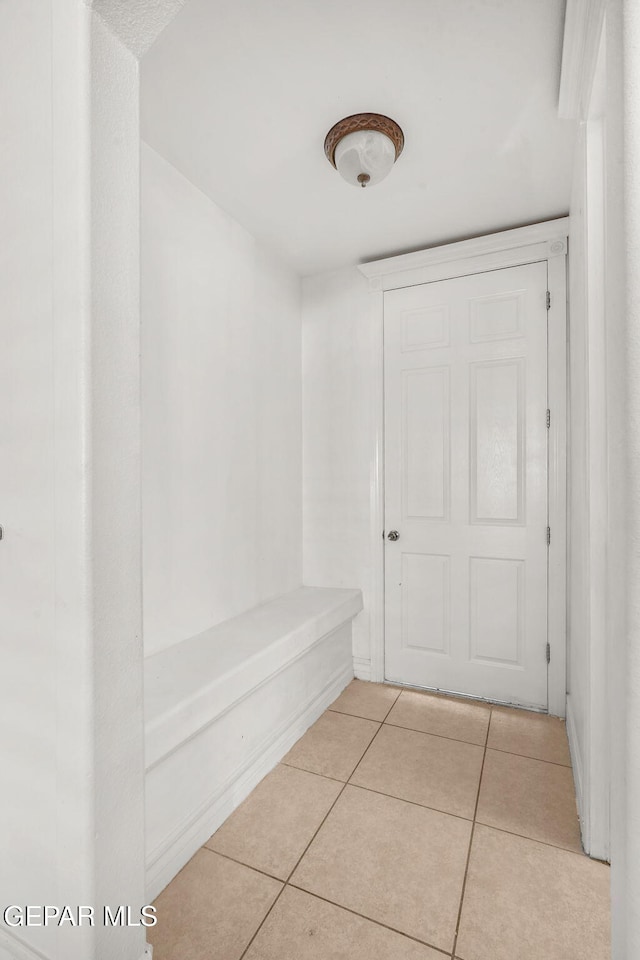 bathroom with tile patterned floors