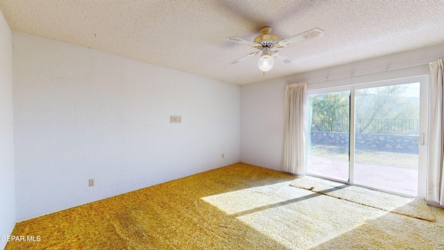 532 Satellite Dr, El Paso, TX 79912 - carpeted empty room with ceiling fan and a textured ceiling