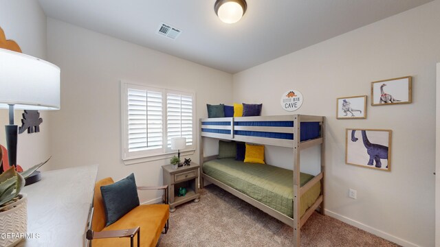 900 Stoke St, El Paso, TX 79928 - carpeted bedroom featuring baseboards