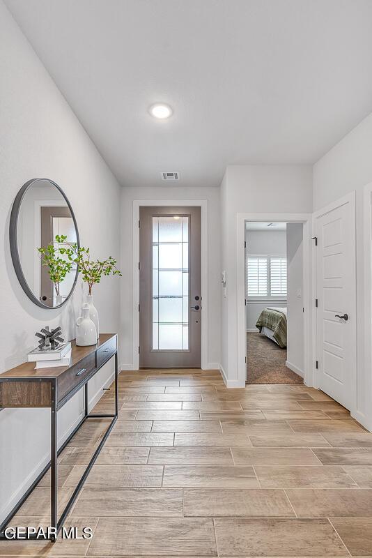 900 Stoke St, El Paso, TX 79928 - entryway featuring wood tiled floors, baseboards, and recessed lighting