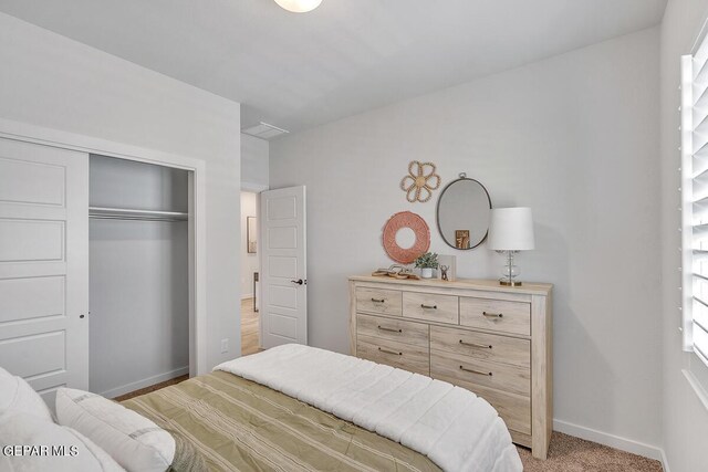 900 Stoke St, El Paso, TX 79928 - bedroom featuring a closet, baseboards, and light colored carpet