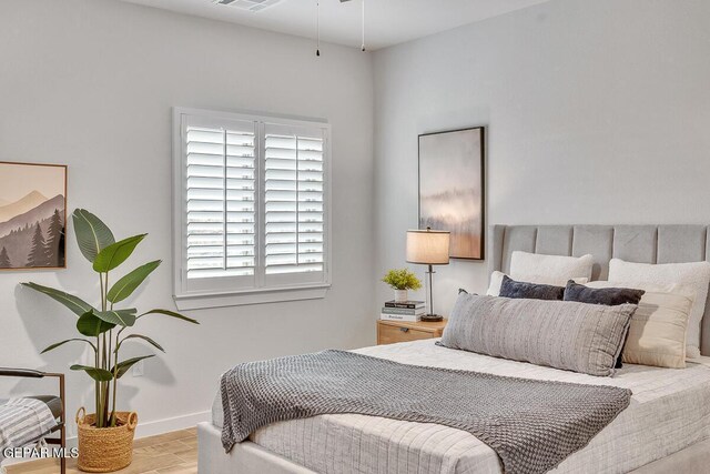 900 Stoke St, El Paso, TX 79928 - bedroom with wood finished floors and baseboards