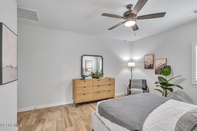 900 Stoke St, El Paso, TX 79928 - bedroom featuring wood finished floors, baseboards, and a ceiling fan