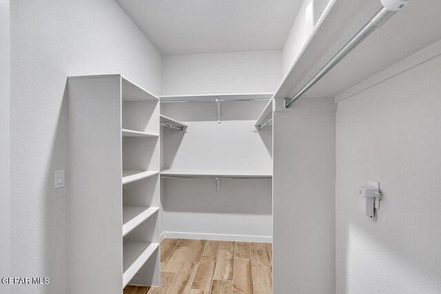 900 Stoke St, El Paso, TX 79928 - walk in closet with wood finished floors