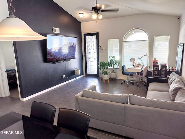 living room with dark hardwood / wood-style floors, vaulted ceiling, and ceiling fan