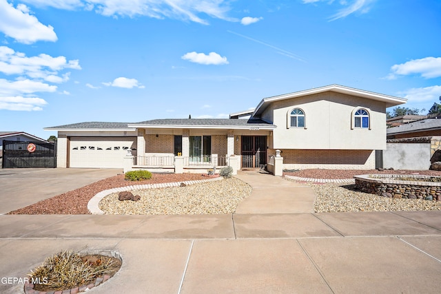 view of front of home featuring a porch and a garage