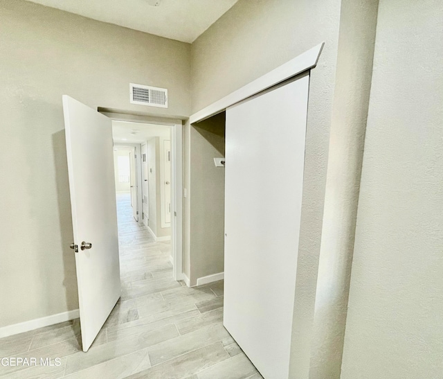 corridor featuring light wood-type flooring