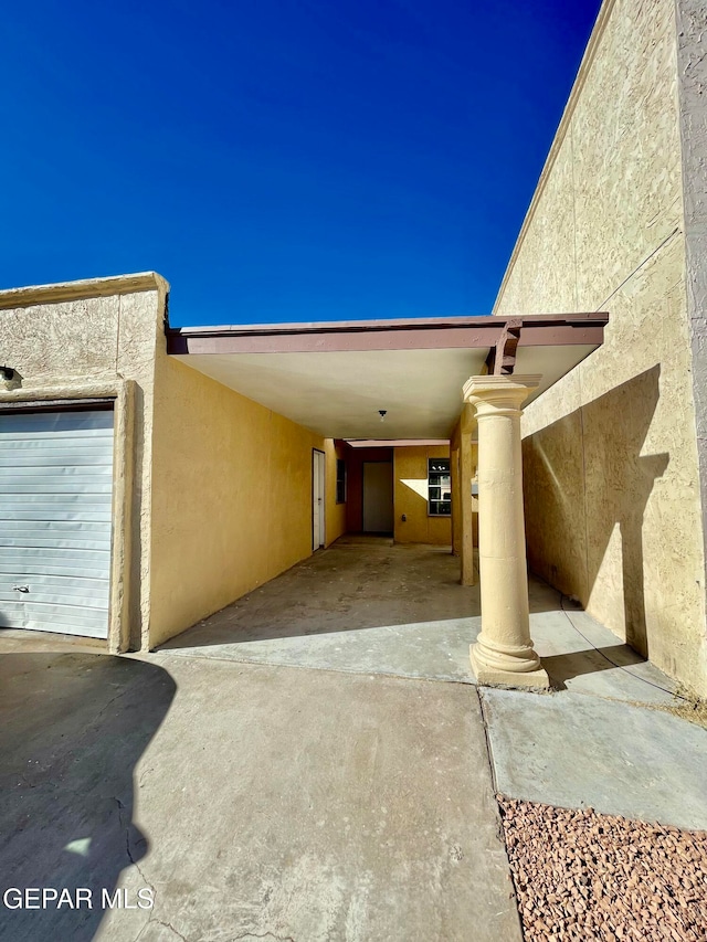 exterior space featuring a carport