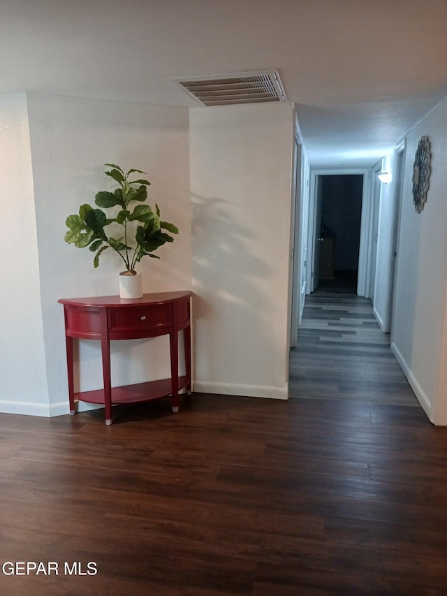 corridor with dark hardwood / wood-style floors